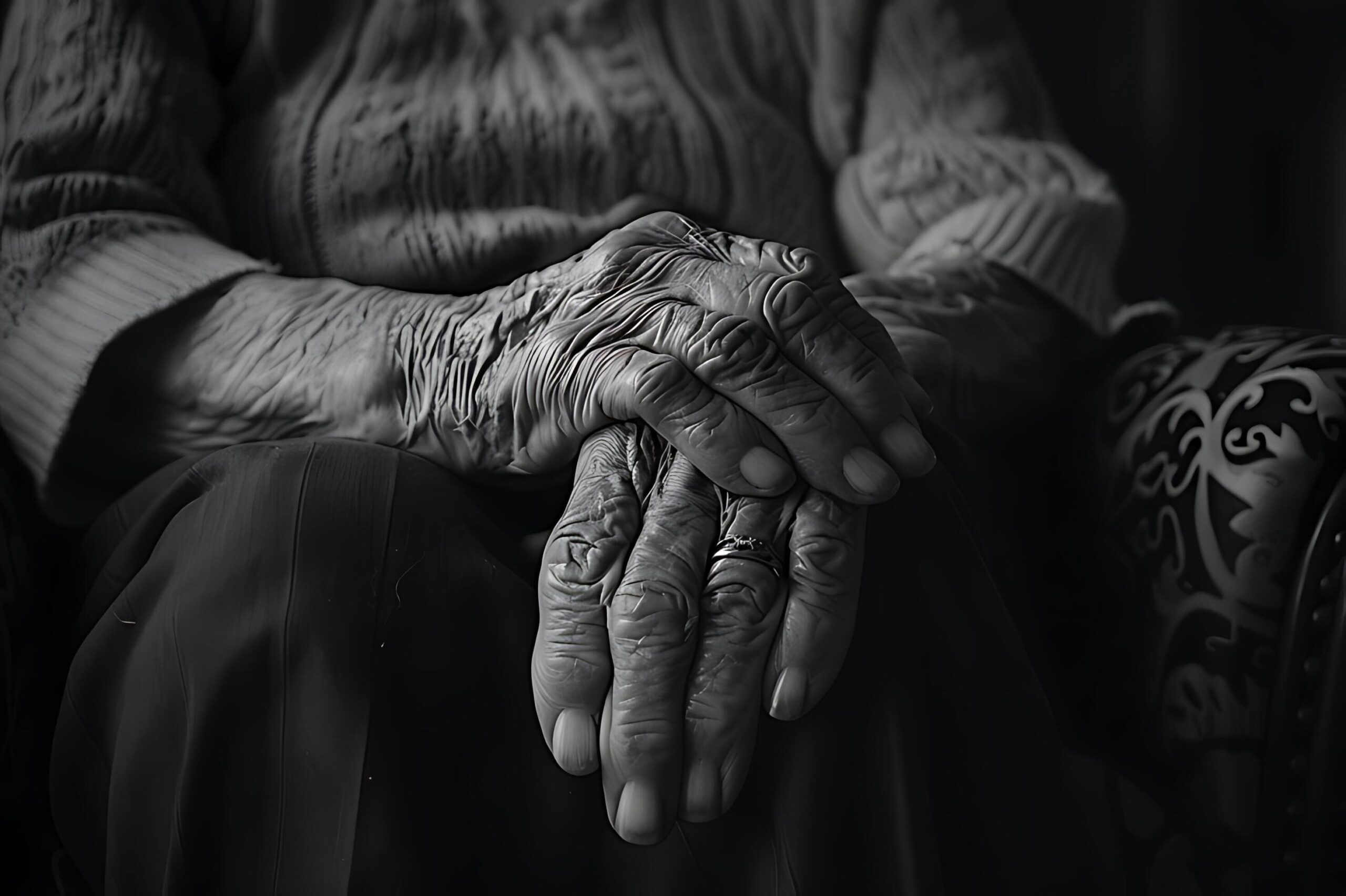 Ai-generated-a-black-and-white-image-of-an-elderly-person-s-hand-is-full-of-stories-and-the-passage-of-time-free-photo