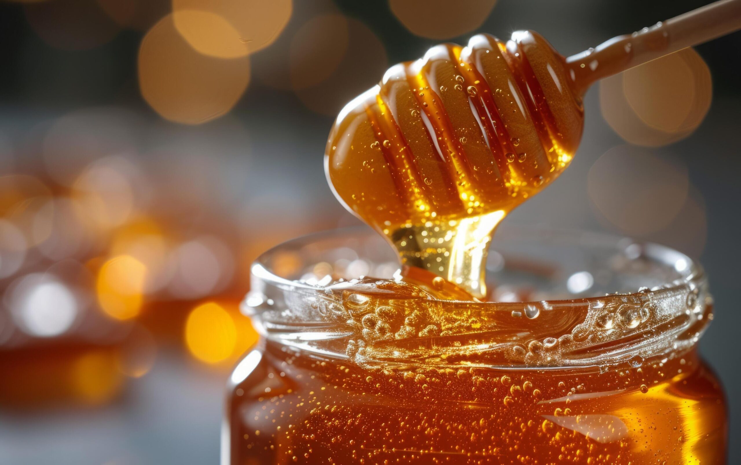 Ai-generated-a-close-up-shot-showcasing-the-richness-of-honey-as-it-flows-from-a-dipper-free-photo