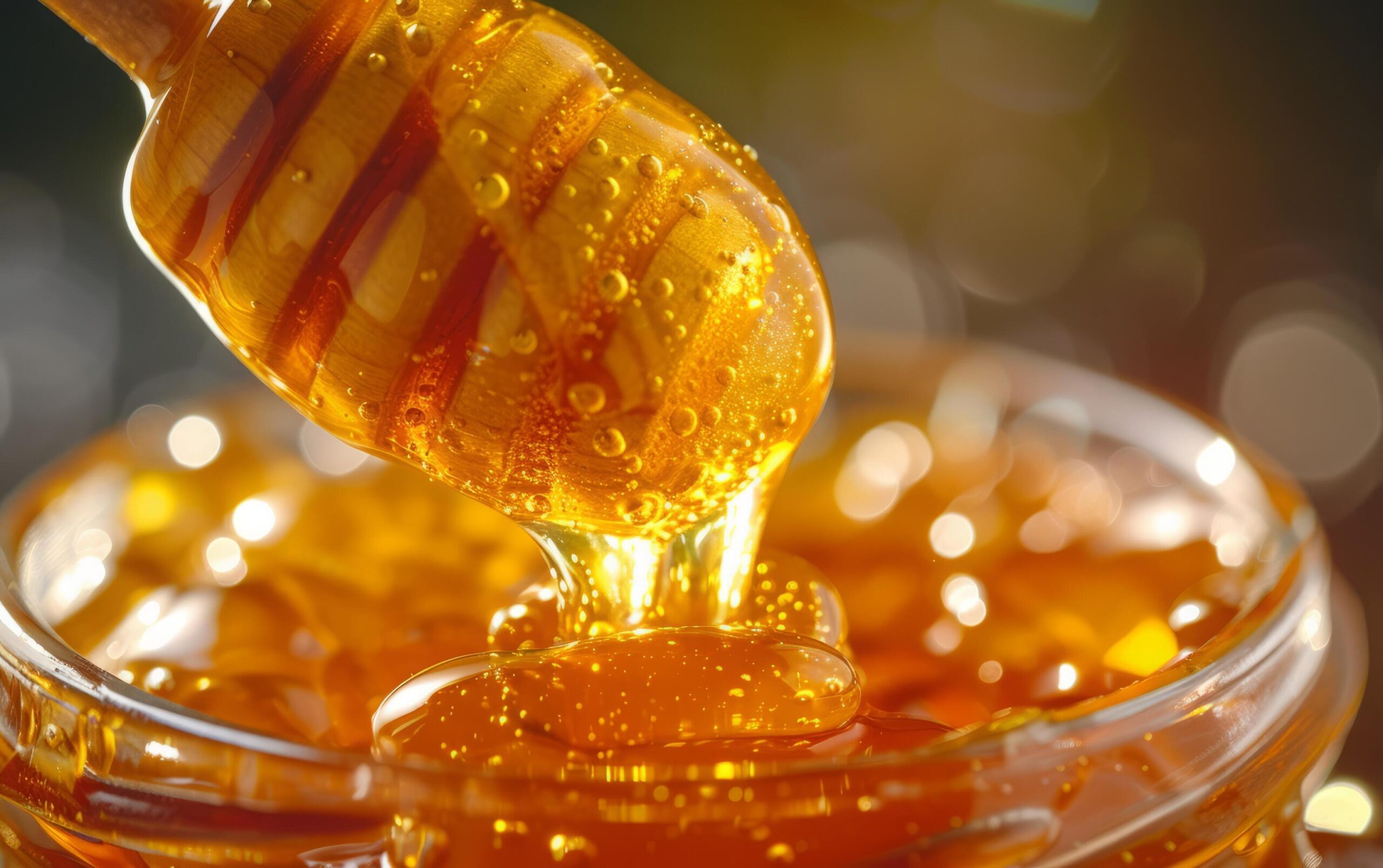 Ai-generated-an-up-close-perspective-of-honey-slowly-dripping-off-a-dipper-free-photo