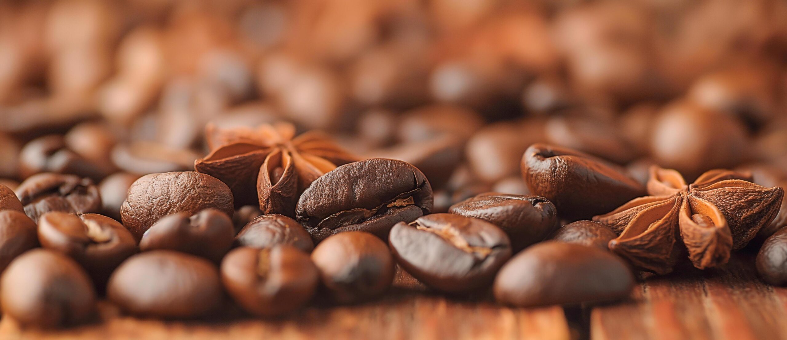 Ai-generated-coffee-beans-and-star-anise-on-a-wooden-table-free-photo