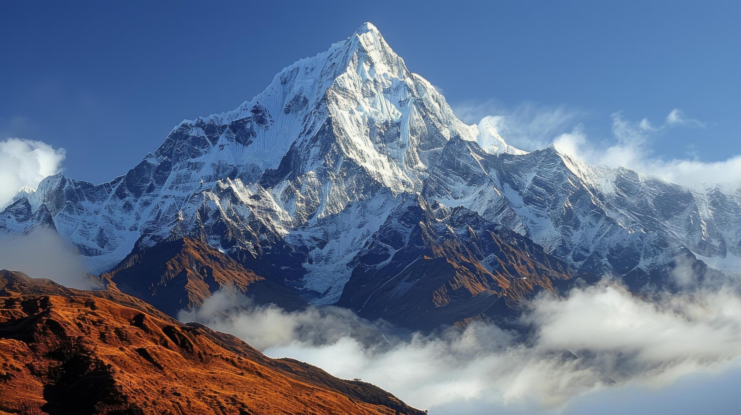 Ai-generated-majestic-mountain-peak-in-snowy-clouds-free-photo