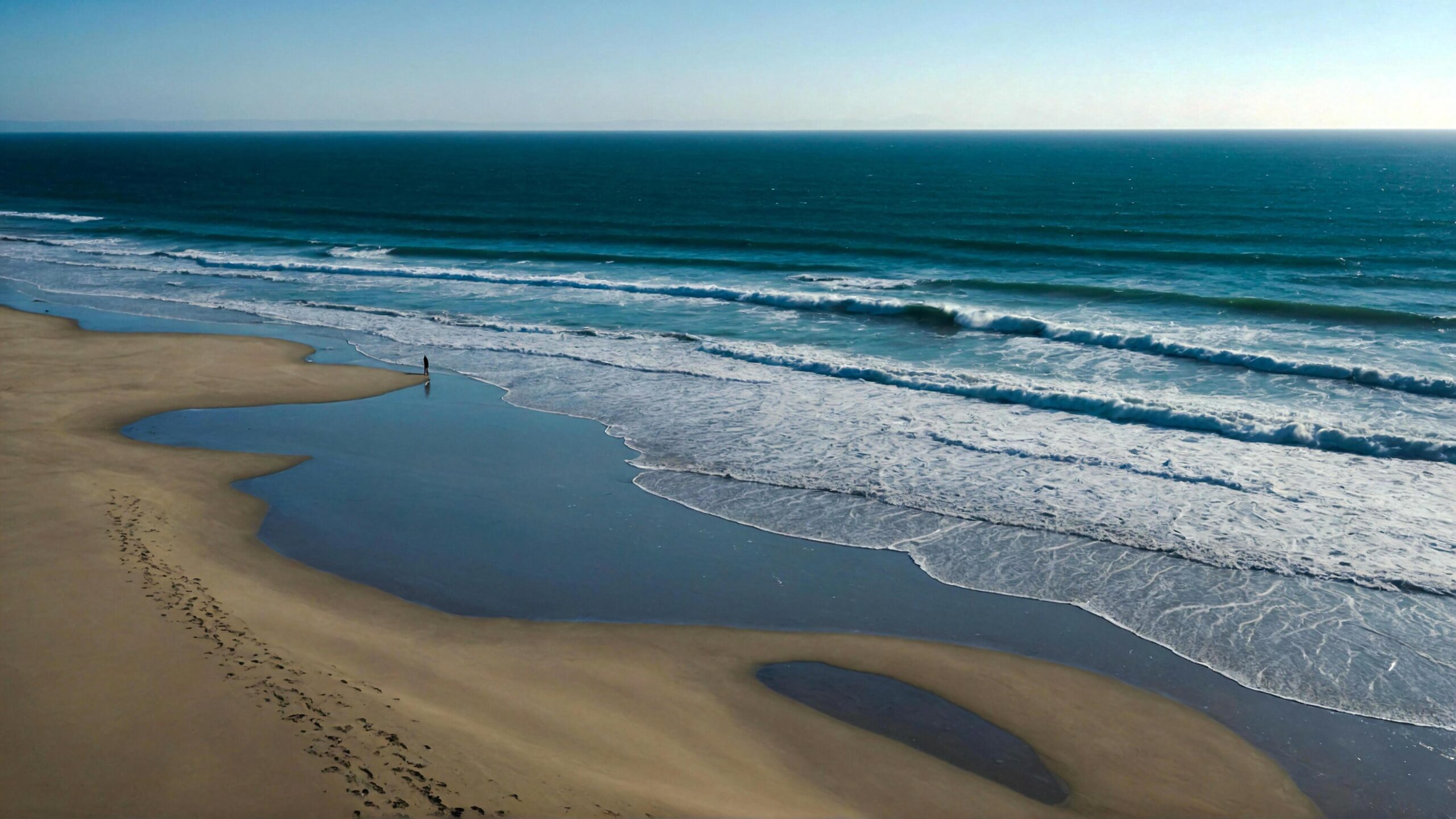 Ai-generated-peaceful-beach-side-stroll-under-vast-clear-skies-with-soft-waves-caressing-the-shore-free-photo