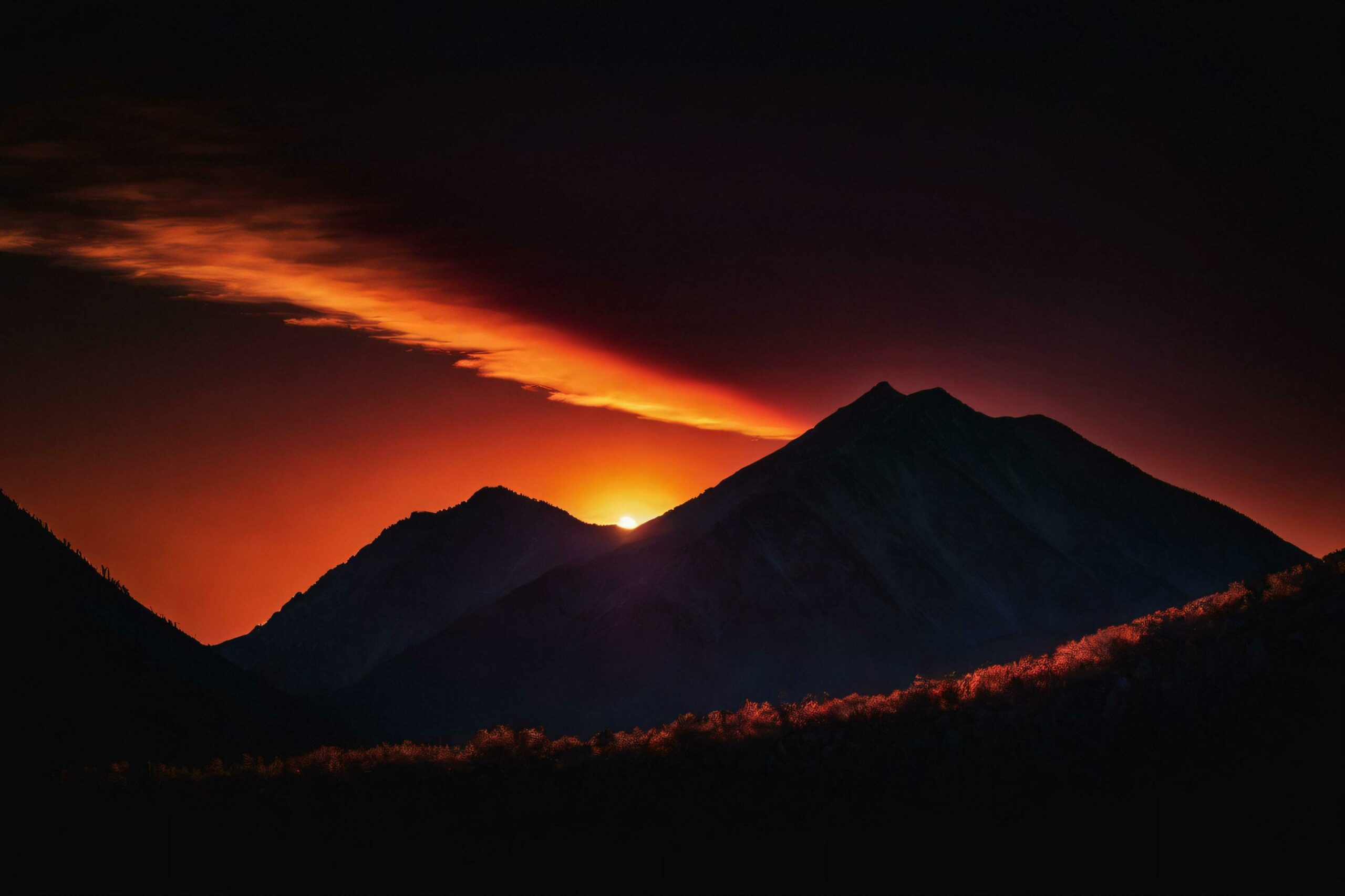 Ai-generated-mountain-peaks-silhouetted-against-fiery-sunset-free-photo